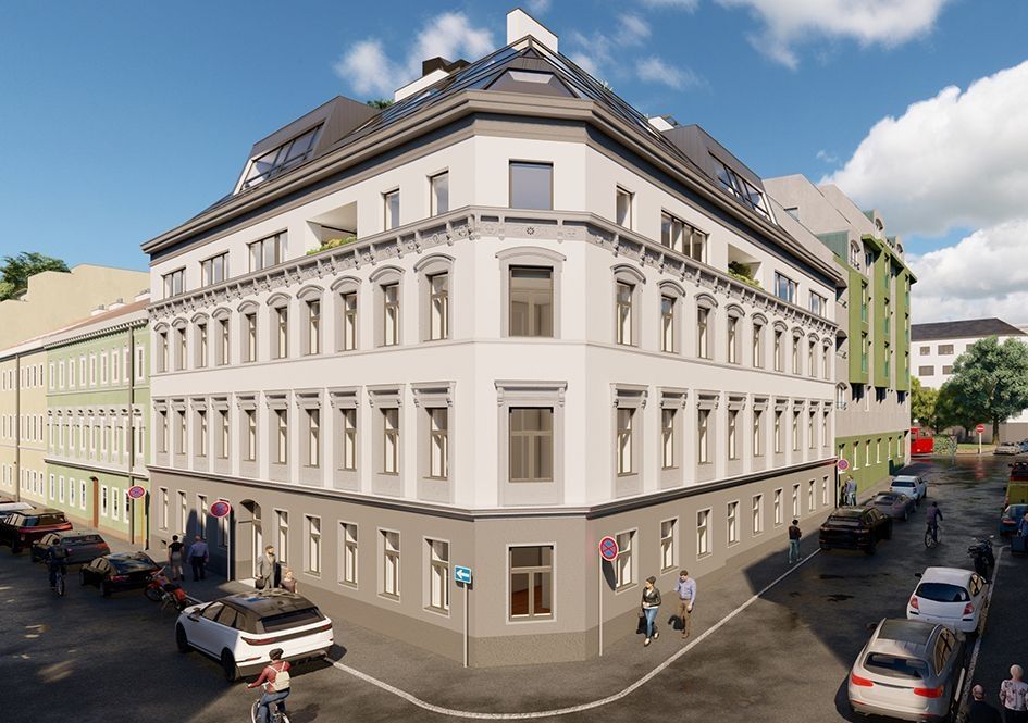 Sanierter Altbau mit Dachgeschossausbau an Straßenecke