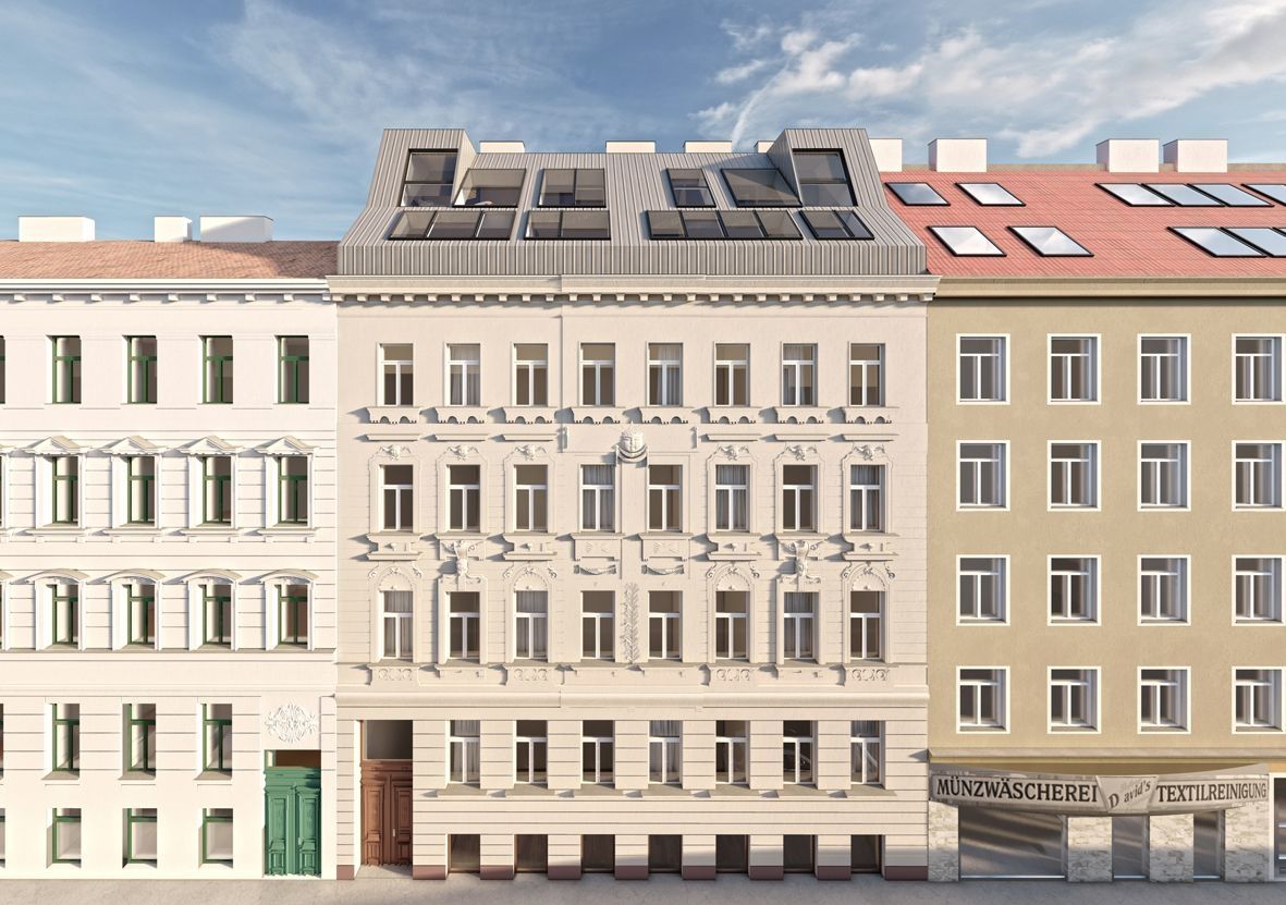 Sanierte Altbaufassade mit modernem Dachgeschoss in Stadtstraße