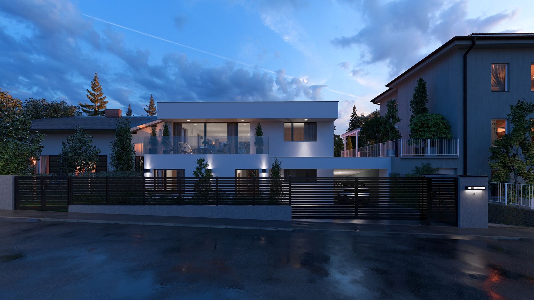 Modernes Einfamilienhaus mit Balkon und schwarzem Zaun