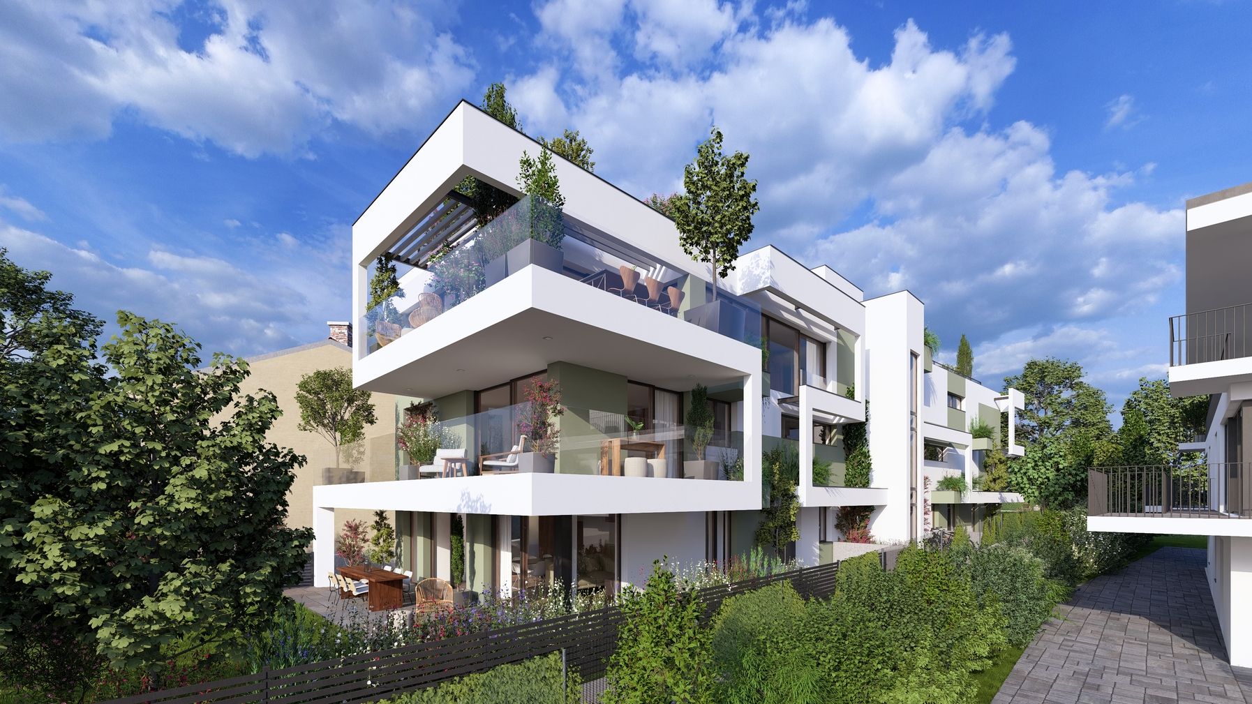 Moderne Wohnanlage mit weißen Fassaden und großzügigen Balkonen