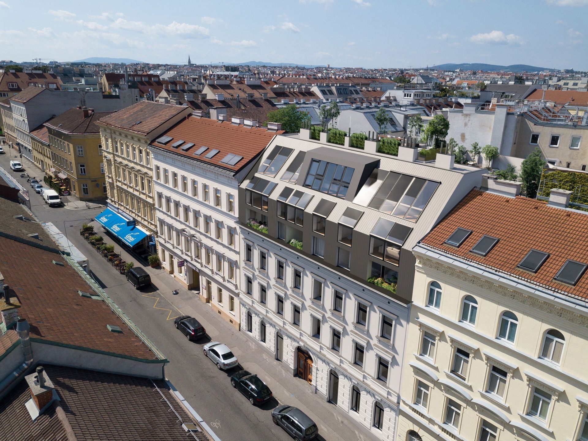 Sanierte Gründerzeitfassade mit modernem Dachausbau